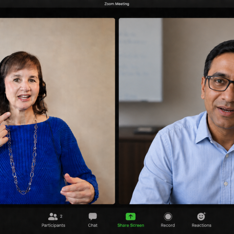 Online accent coach leading a virtual English communication lesson with a professional client on a video call